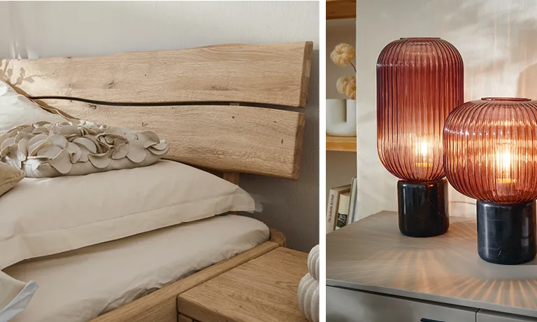 Ledersessel in hellem Raum mit Holzboden, Esstisch aus Holz mit dunklen Stühlen auf Teppich vor Fenster, Kopfteil eines Polsterbetts aus Holz im natürlichen Look, zwei dekoraktive Lampen in Rotbraun