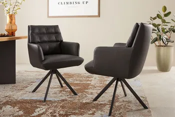 Schwarze Design Armlederstühle aus Leder mit Steppung an der Rückenlehne. 