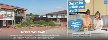 Auf der linken Seite des Bildes sieht man das wolfrath Einrichtunghaus und das wöm. Auf der rechten Seite wird eine Küchen-Aktion beworben