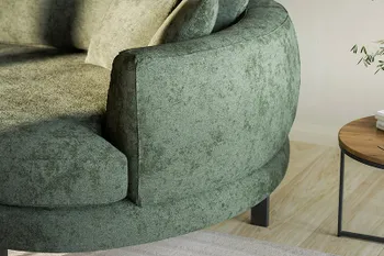 Detailbild von grüne Stoffsofa mit rundem Abschlusselement. 